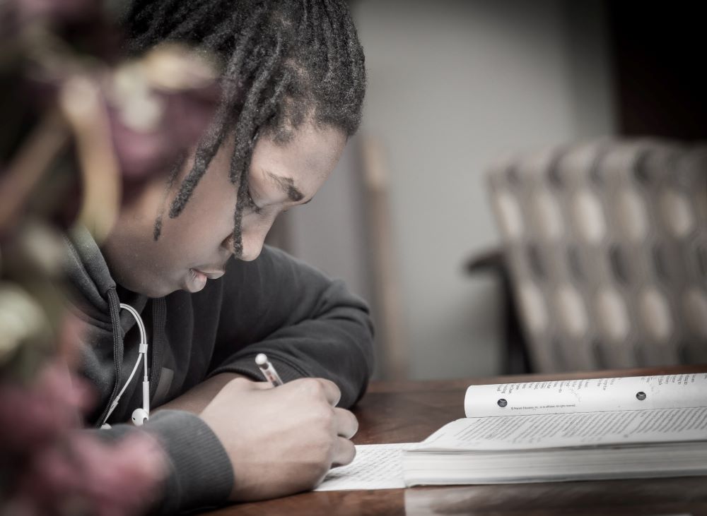 young man taking a test to evaluate for disorder of written expression